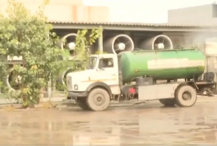 Delhi Govt Reporting Fake AQI? The Controversy Behind Water Sprinkling Near Pollution Monitoring Stations Delhi